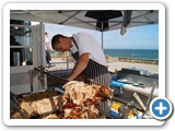 Carving every last bit of pork off the bone